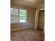 Bedroom with carpet, tan walls, large windows, and closet at 2475 Cajun Dr, Marietta, GA 30066