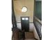 Entryway with dark trim, wooden stairs, decorative light fixture, and tiled stairs at 2475 Cajun Dr, Marietta, GA 30066