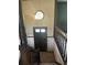 Foyer view featuring dark trim, carpeted stairs, and a decorative pendant light at 2475 Cajun Dr, Marietta, GA 30066