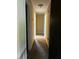 Hallway with neutral carpet, tan walls, and dark doors at 2475 Cajun Dr, Marietta, GA 30066