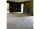Spacious living room featuring fireplace, neutral carpet, and door to sunroom at 2475 Cajun Dr, Marietta, GA 30066