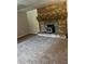 A cozy living room featuring neutral carpet and a large brick fireplace, perfect for gatherings at 2475 Cajun Dr, Marietta, GA 30066