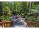 Landscaped backyard with stone pathway leading to an outdoor sitting area, great for entertaining at 401 Emory Ne Dr, Atlanta, GA 30307