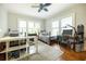 Bright bedroom with two twin beds, a desk, and a snowboard leaning against the wall at 401 Emory Ne Dr, Atlanta, GA 30307