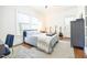 Bedroom with a simple metal bed frame and an assortment of guitars at 401 Emory Ne Dr, Atlanta, GA 30307
