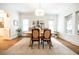 Bright dining room featuring hardwood floors, natural light, and modern chandelier at 401 Emory Ne Dr, Atlanta, GA 30307