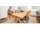 Dining room featuring a wooden table, chairs, and neutral tones at 401 Emory Ne Dr, Atlanta, GA 30307