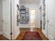 Hallway with hardwood floors and walls adorned with framed photos at 401 Emory Ne Dr, Atlanta, GA 30307