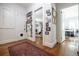 Hallway with an ornate red rug and walls adorned with framed photos at 401 Emory Ne Dr, Atlanta, GA 30307