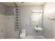 Clean bathroom featuring a floating sink, tile walls, and a shower curtain at 10 Ne Perimeter Summit Blvd # 3107, Atlanta, GA 30319