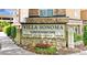 Stone Villa Sonoma Condominiums sign with landscaping and a view of the building at 10 Ne Perimeter Summit Blvd # 3107, Atlanta, GA 30319