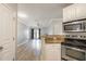 Open kitchen view into living area with stainless appliances and granite countertops at 10 Ne Perimeter Summit Blvd # 3107, Atlanta, GA 30319