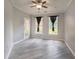 Open-concept living room filled with natural light from its two windows and a glass patio door at 10 Ne Perimeter Summit Blvd # 3107, Atlanta, GA 30319