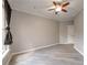 The spacious living room features wood grain vinyl flooring and a ceiling fan at 10 Ne Perimeter Summit Blvd # 3107, Atlanta, GA 30319