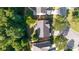 A charming single-Gathering home features mature trees and well-maintained landscaping from an aerial view at 4770 Shiloh Springs Rd, Cumming, GA 30040