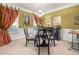 Dining room boasts wainscoting, neutral carpet, updated light fixture and modern decor at 4770 Shiloh Springs Rd, Cumming, GA 30040