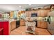 Charming kitchen featuring wood cabinets, granite countertops, and stainless steel appliances at 4770 Shiloh Springs Rd, Cumming, GA 30040