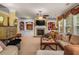 Spacious living room featuring a fireplace, built-in shelving, and ample natural light at 4770 Shiloh Springs Rd, Cumming, GA 30040