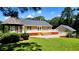 Well-maintained backyard featuring a spacious deck, gazebo, and lush green lawn at 5300 Haynes Creek Dr, Loganville, GA 30052