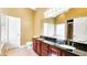 Well-appointed bathroom with double vanity, granite countertop, and a large mirror over the sinks at 5300 Haynes Creek Dr, Loganville, GA 30052