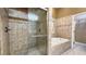 Luxurious bathroom featuring tiled shower, soaking tub, and a separate water closet for added privacy at 5300 Haynes Creek Dr, Loganville, GA 30052