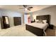 Bedroom with carpet flooring, ceiling fan, and walk-in closet at 5300 Haynes Creek Dr, Loganville, GA 30052