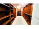 Walk-in closet with custom built-in shelves and drawers at 5300 Haynes Creek Dr, Loganville, GA 30052