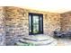 Charming front porch with stone accents and seating area at 5300 Haynes Creek Dr, Loganville, GA 30052