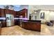 Modern kitchen with stainless steel appliances, dark wood cabinets, and granite countertops at 5300 Haynes Creek Dr, Loganville, GA 30052