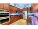 Gourmet kitchen with built-in stainless steel appliances, granite counters, and tile floors at 5300 Haynes Creek Dr, Loganville, GA 30052