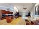 Open-concept living room and kitchen area with tile flooring and vaulted ceilings at 5300 Haynes Creek Dr, Loganville, GA 30052