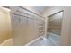 Spacious walk-in closet with ample shelving and custom organization system for optimal storage at 5300 Haynes Creek Dr, Loganville, GA 30052