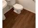 Bathroom featuring a white toilet and pedestal sink at 1865 Ellison Lakes Nw Ct # 21, Kennesaw, GA 30152