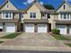 Charming townhomes featuring garages and landscaped front yards at 1865 Ellison Lakes Nw Ct # 21, Kennesaw, GA 30152