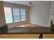 Living room with multiple windows providing lots of natural light and an adjacent granite kitchen countertop at 1865 Ellison Lakes Nw Ct # 21, Kennesaw, GA 30152