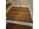 Staircase with laminate flooring on stair landing at 1865 Ellison Lakes Nw Ct # 21, Kennesaw, GA 30152