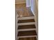 Close up of staircase with freshly painted white risers and stained treads at 1865 Ellison Lakes Nw Ct # 21, Kennesaw, GA 30152