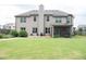Large backyard with a patio area and a custom stone fire pit; perfect for outdoor entertainment at 3739 In Bloom Way, Auburn, GA 30011