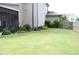 Well-manicured backyard with a relaxing screened patio and lush landscaping at 3739 In Bloom Way, Auburn, GA 30011
