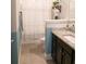 Bathroom featuring a granite countertop, dark wood vanity, and a striped shower curtain at 3739 In Bloom Way, Auburn, GA 30011
