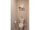 Half bathroom with a white toilet, tile flooring, and shelf with decorative items at 3739 In Bloom Way, Auburn, GA 30011