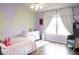 bedroom with a painted wall, white dresser, chair and natural light at 3739 In Bloom Way, Auburn, GA 30011