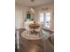 Cozy breakfast nook with a round table, decorative rug, and natural light at 3739 In Bloom Way, Auburn, GA 30011