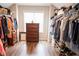 Spacious walk-in closet with shelving, drawers, and hanging racks for optimal storage at 3739 In Bloom Way, Auburn, GA 30011