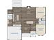 Detailed floor plan of the home's first level featuring a kitchen, living room and two-car garage at 3739 In Bloom Way, Auburn, GA 30011