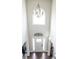 Elegant foyer features a chandelier, arched window, and grand entrance at 3739 In Bloom Way, Auburn, GA 30011
