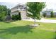 Well-maintained front yard with healthy green lawn and mature landscaping at 3739 In Bloom Way, Auburn, GA 30011