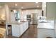 Modern kitchen with stainless steel appliances, granite countertops, and a large island at 3739 In Bloom Way, Auburn, GA 30011