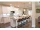 Spacious kitchen with a large island, granite counters, and stainless steel appliances at 3739 In Bloom Way, Auburn, GA 30011