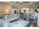 Open-concept living room leading into a modern kitchen with a large island at 3739 In Bloom Way, Auburn, GA 30011